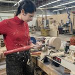 Student learning to turn a bowl.